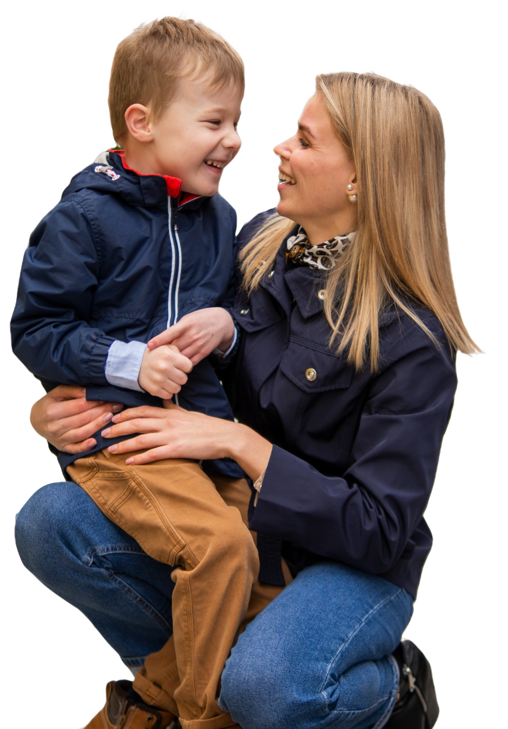 Woman holding her child and smiling.